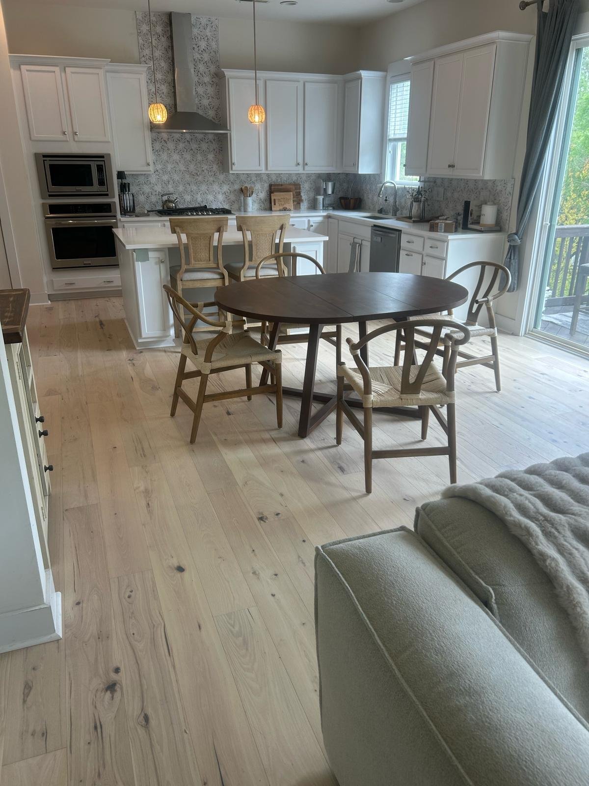Light hardwood in the kitchen and dining area