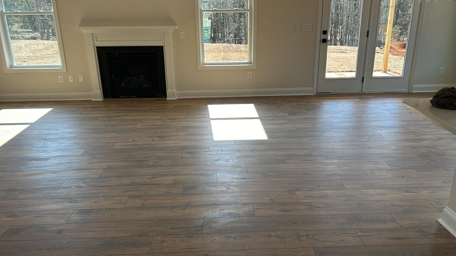 Luxury vinyl plank in a living room with fireplace