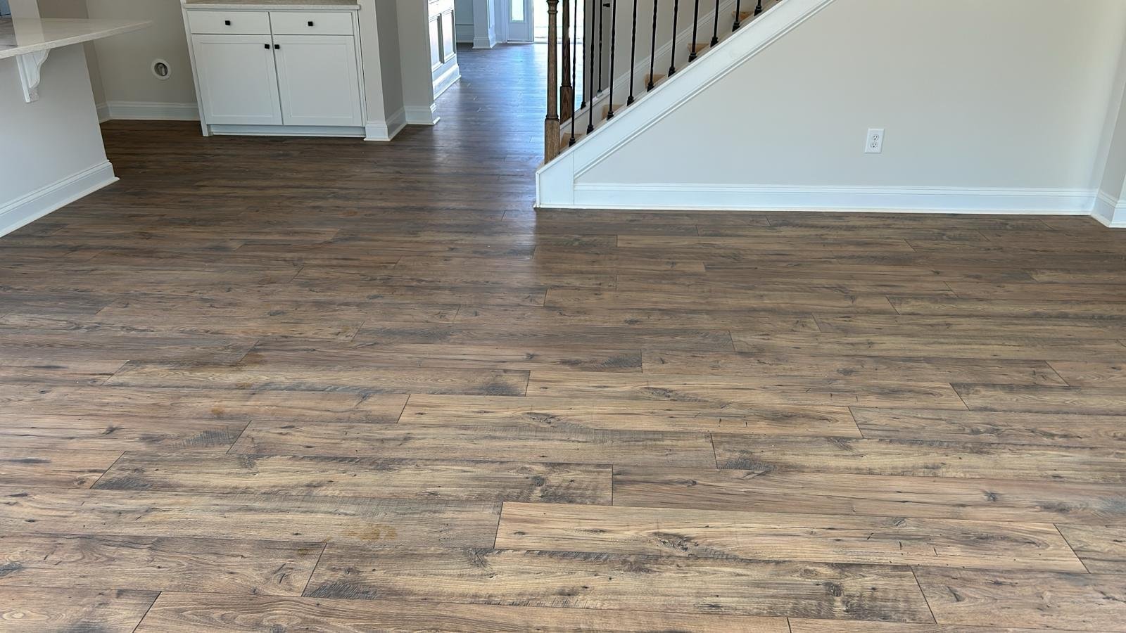 Luxury vinyl plank in the living room and stair hall