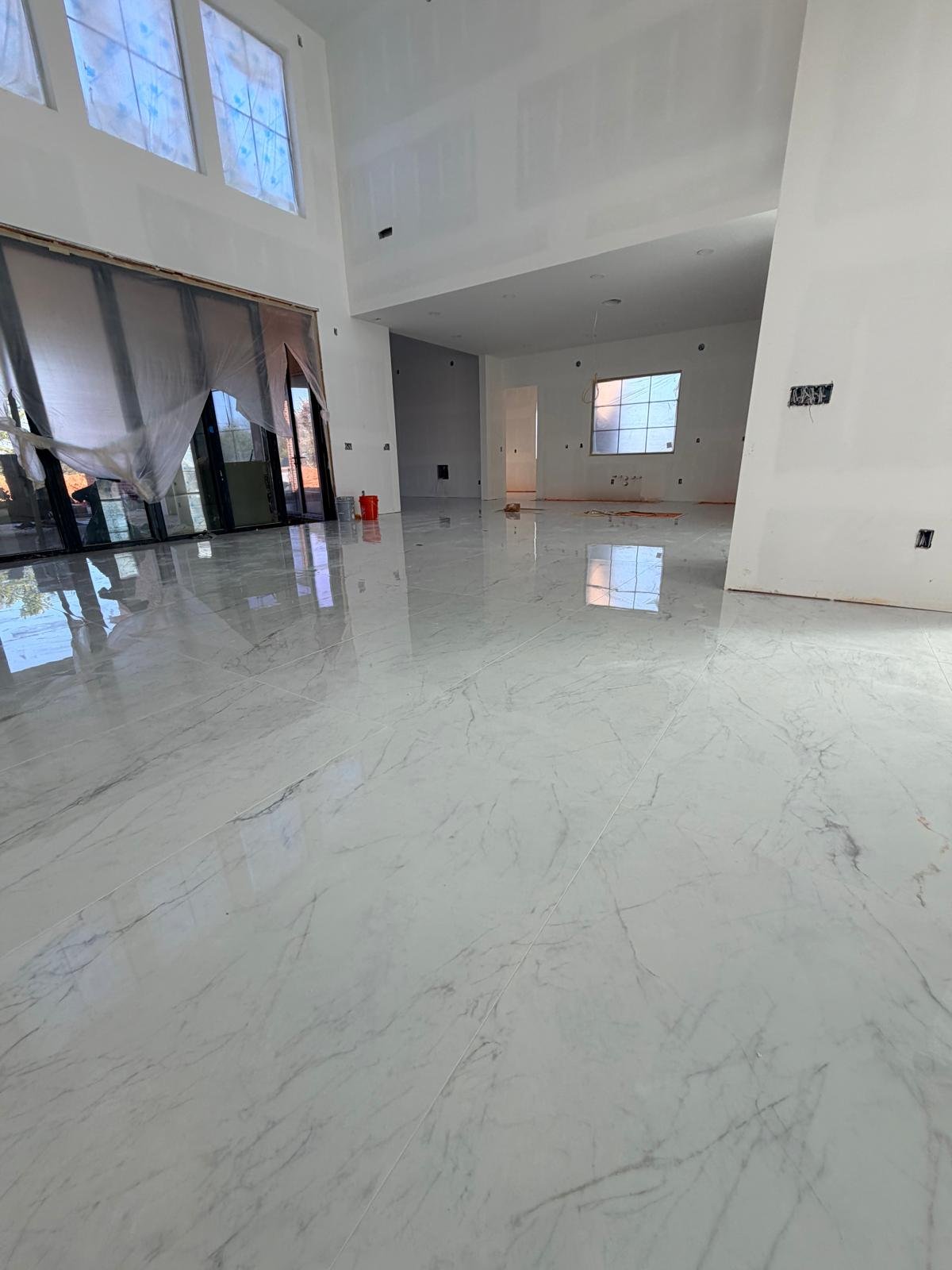 Polished porcelain in a double-height living room