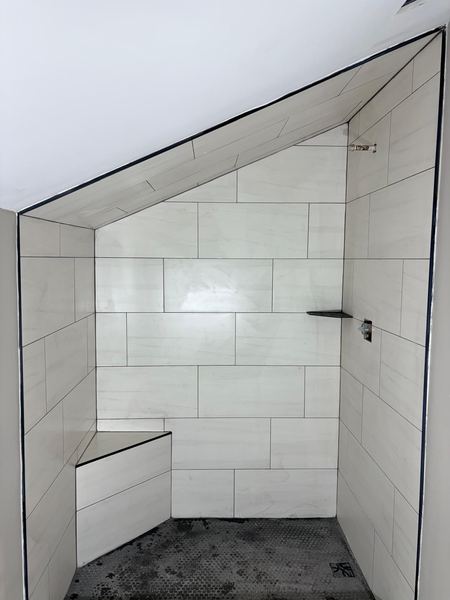 White porcelain shower with bench