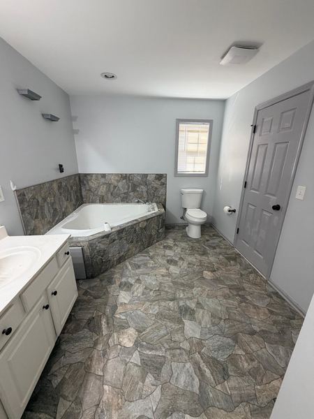 Bathroom with natural stone floor