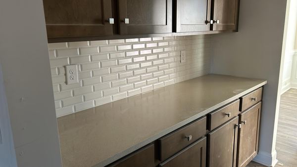White subway backsplash on the countertop