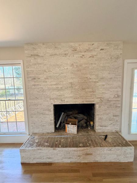 Light stone fireplace surround