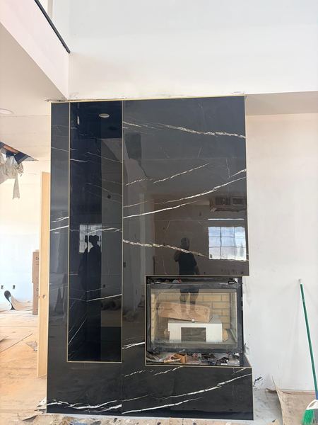 Fireplace surround in black marble-look porcelain