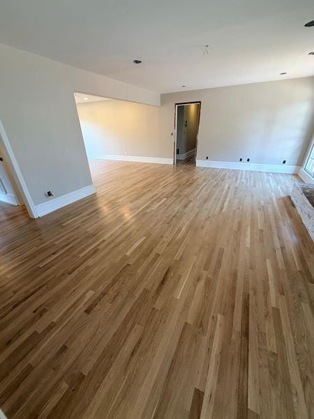 Natural hardwood floor in a spacious living room